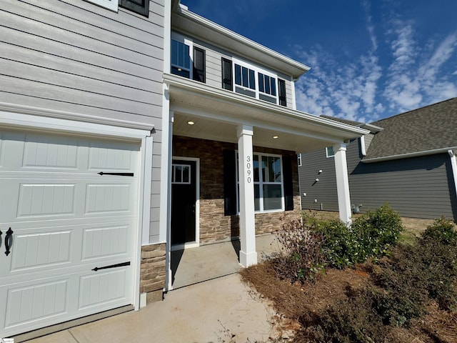 doorway to property featuring a garage