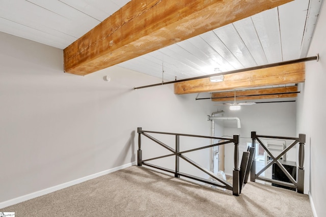 bonus room featuring beamed ceiling, carpet floors, and wood ceiling