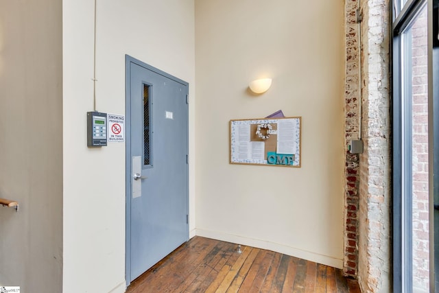 entryway with dark wood-type flooring