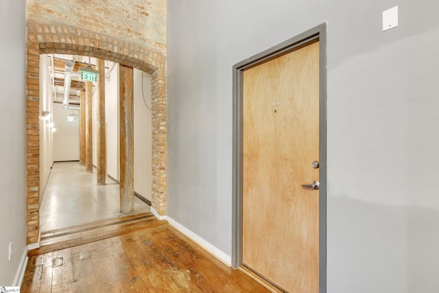 hall with hardwood / wood-style floors