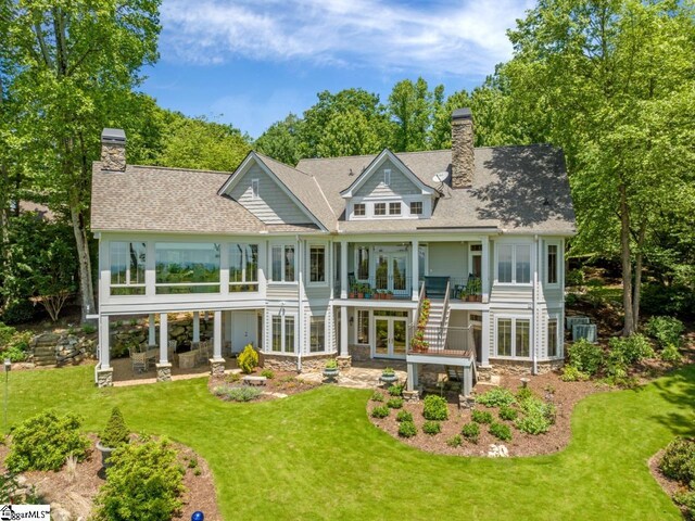 rear view of house with a lawn