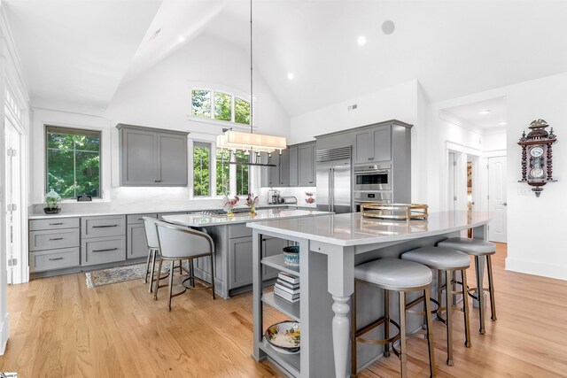 kitchen featuring gray cabinets and light wood-type flooring