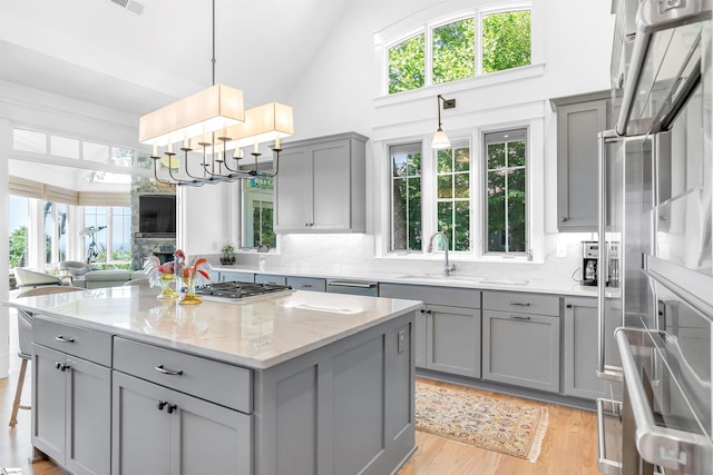 7 Drift Away Ln, Landrum, SC 29356 - kitchen with a sink, gray cabinets, a kitchen island, and appliances with stainless steel finishes