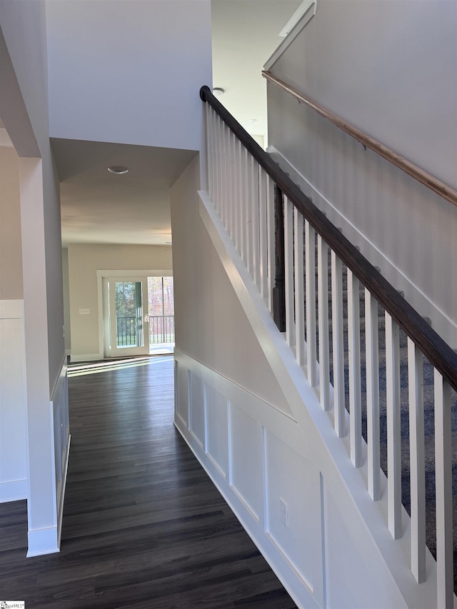 stairs featuring hardwood / wood-style flooring