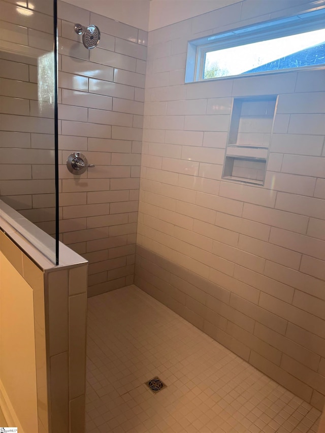 bathroom featuring tiled shower