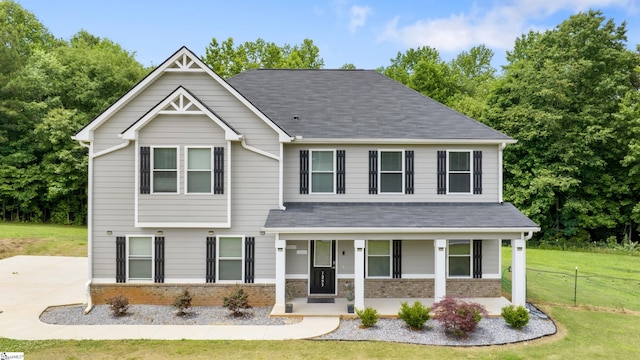 view of front of house with a front lawn and a porch