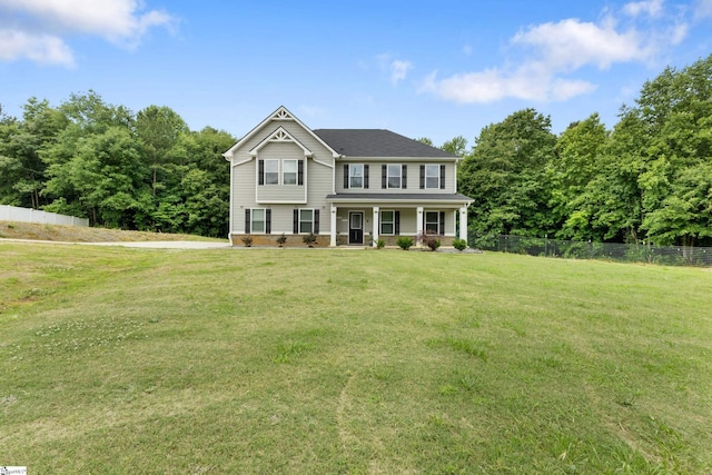 view of front of property with a porch and a front yard