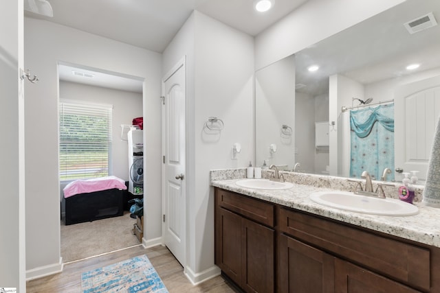 bathroom featuring hardwood / wood-style flooring, vanity, and a shower with curtain