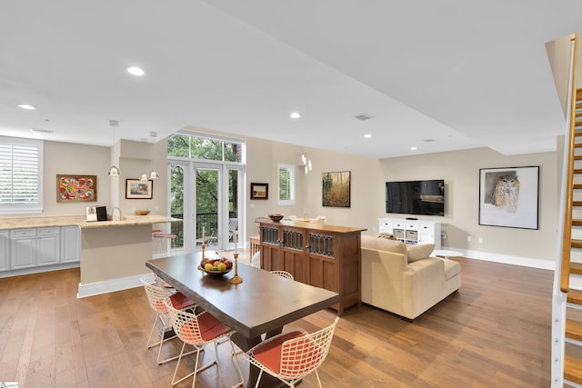 dining area with light hardwood / wood-style flooring