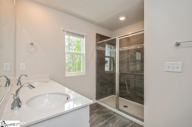 bathroom featuring vanity and an enclosed shower