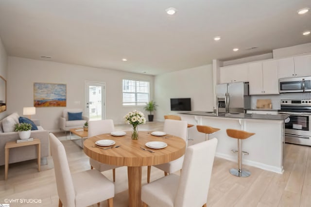 dining space featuring light hardwood / wood-style flooring