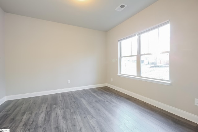 empty room featuring dark wood-type flooring