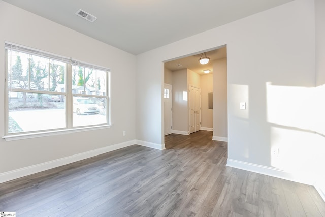 empty room with hardwood / wood-style floors