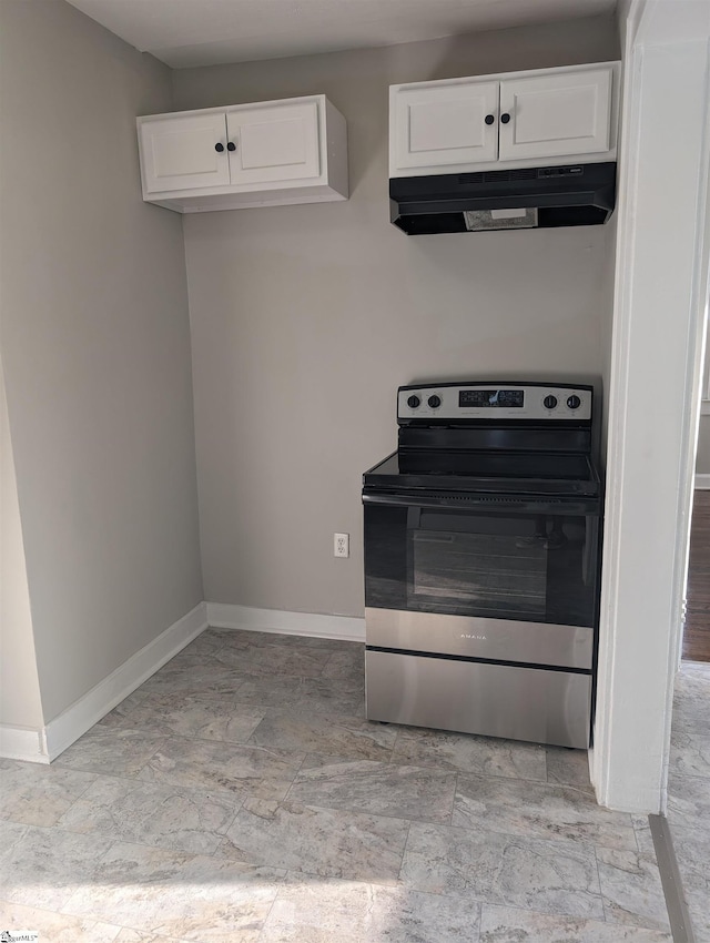 kitchen featuring stainless steel electric range and white cabinets