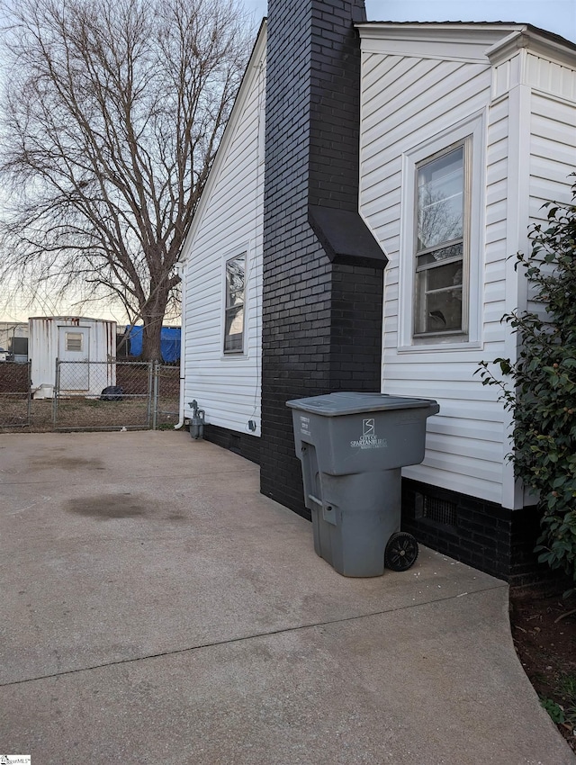 view of side of home with a patio area