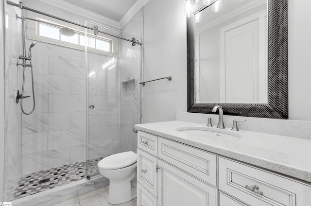 bathroom with toilet, vanity, a shower with door, and crown molding