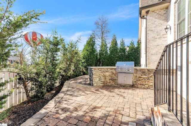 view of patio / terrace featuring grilling area and exterior kitchen