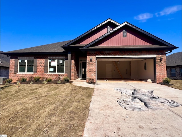 view of front of house featuring a garage and a front yard