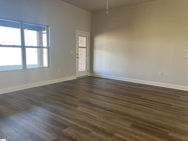 spare room featuring dark hardwood / wood-style floors