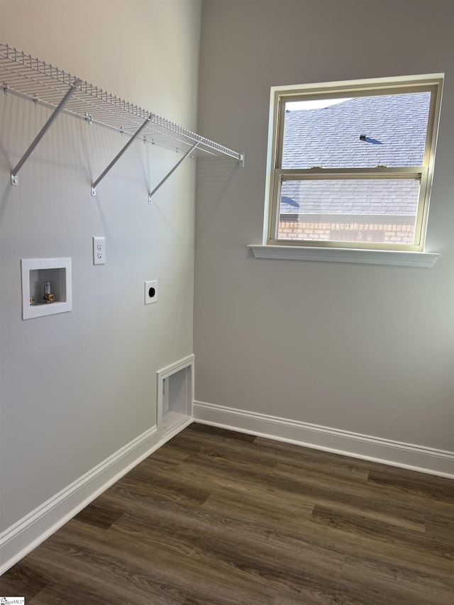 laundry area with dark hardwood / wood-style flooring, hookup for an electric dryer, and hookup for a washing machine