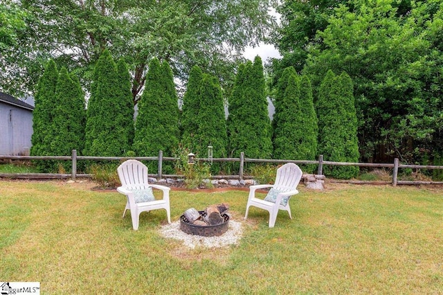 view of yard with a fire pit