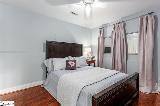 bedroom with ceiling fan and dark hardwood / wood-style floors