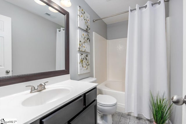 full bathroom with vanity, shower / bathtub combination with curtain, and toilet