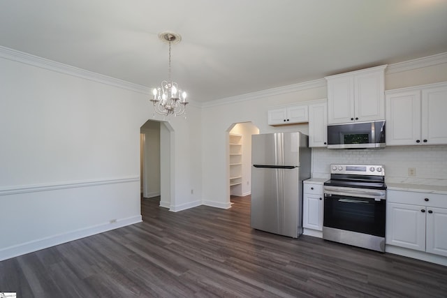 kitchen featuring appliances with stainless steel finishes, dark hardwood / wood-style flooring, tasteful backsplash, crown molding, and white cabinets