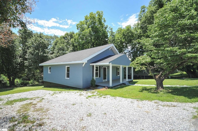 view of front of property with a porch and a front yard