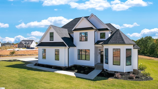 modern inspired farmhouse with a front yard