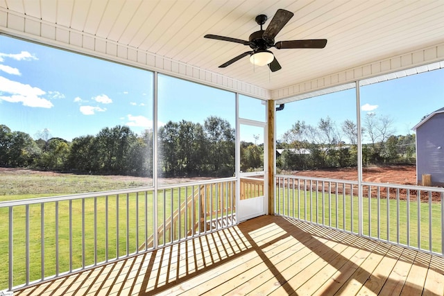 unfurnished sunroom with ceiling fan and a healthy amount of sunlight