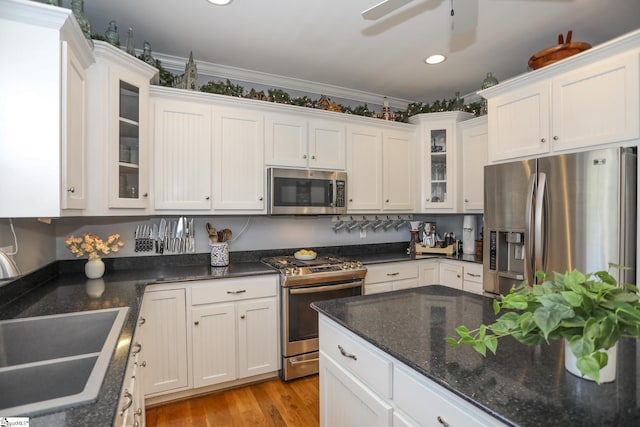 kitchen with white cabinetry, sink, and appliances with stainless steel finishes