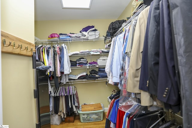 walk in closet featuring hardwood / wood-style floors