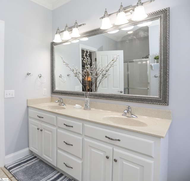 bathroom with vanity, walk in shower, and crown molding