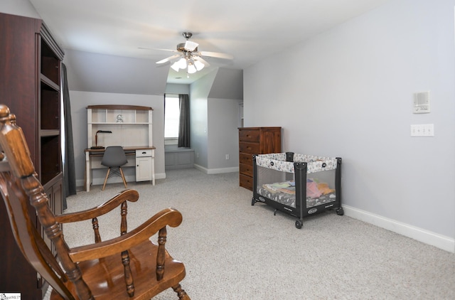 sitting room with light carpet, ceiling fan, and lofted ceiling