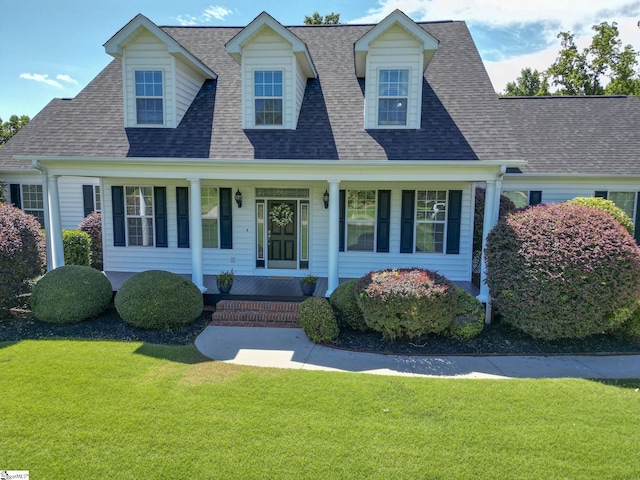 new england style home featuring a front lawn