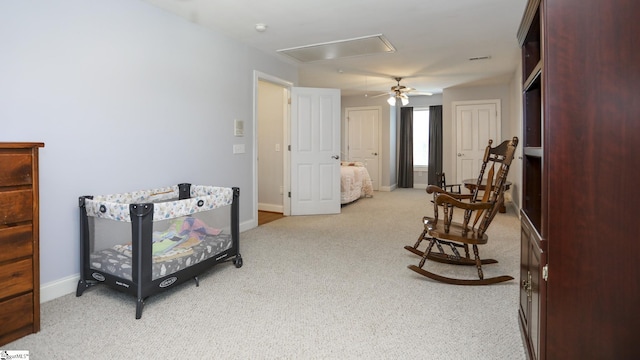 bedroom with ceiling fan and light colored carpet