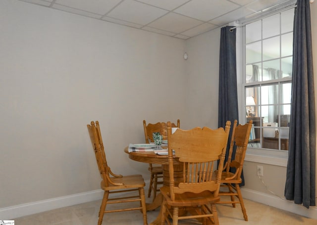 dining room with a paneled ceiling