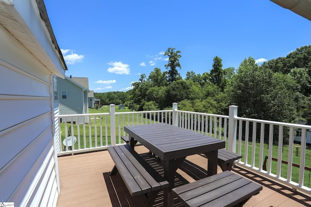 deck featuring a lawn