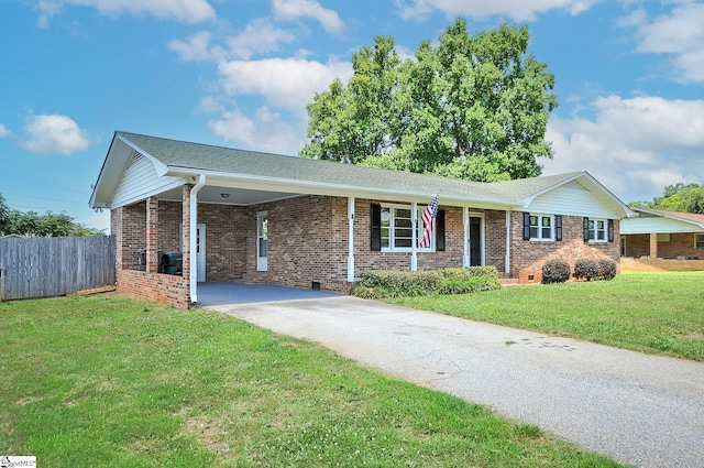 single story home with a front yard and a carport