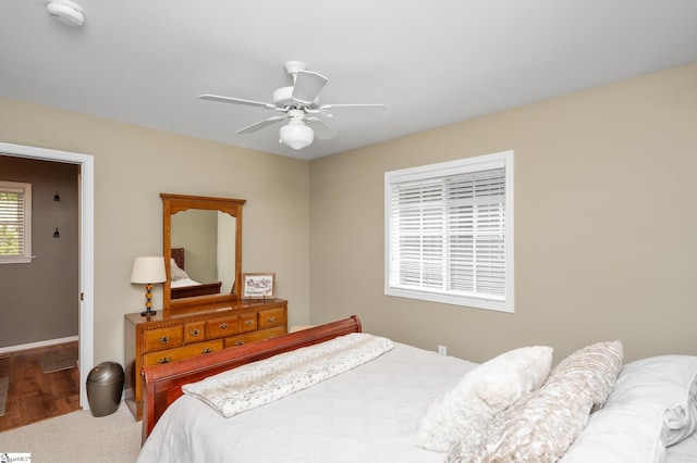 bedroom with wood-type flooring and ceiling fan