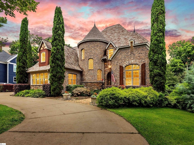 view of front of home with a lawn