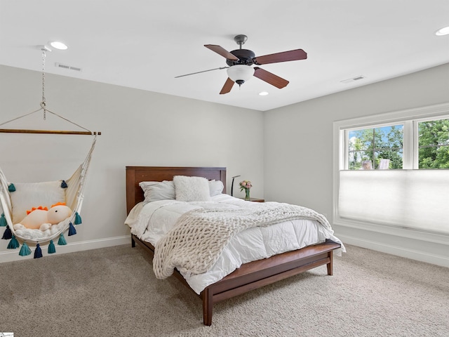 carpeted bedroom with ceiling fan