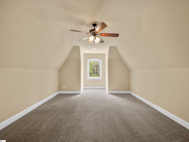 additional living space with carpet flooring, ceiling fan, and lofted ceiling