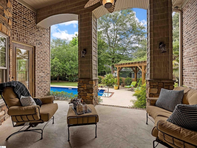 view of patio with an outdoor living space, a pergola, and ceiling fan