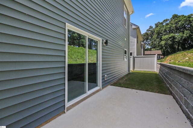 view of patio featuring fence