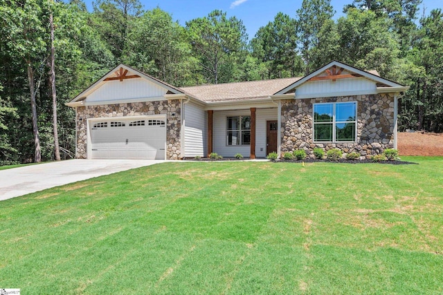 view of front of home featuring a garage, stone siding, a front lawn, and driveway