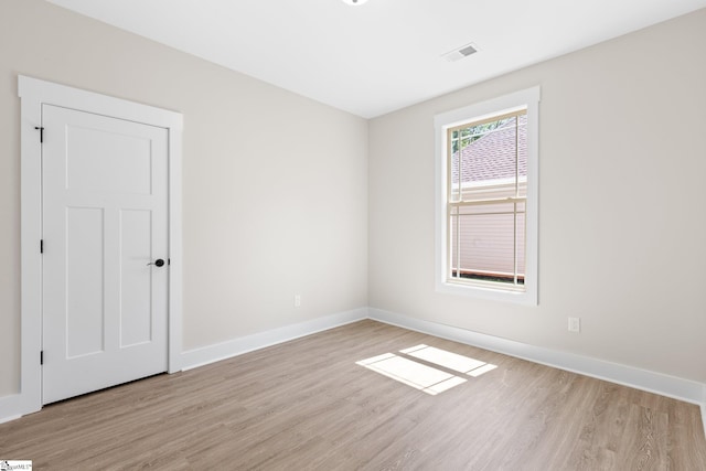 unfurnished room with light hardwood / wood-style flooring