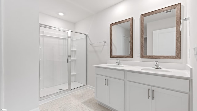 bathroom with an enclosed shower and vanity