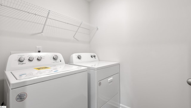 washroom with independent washer and dryer